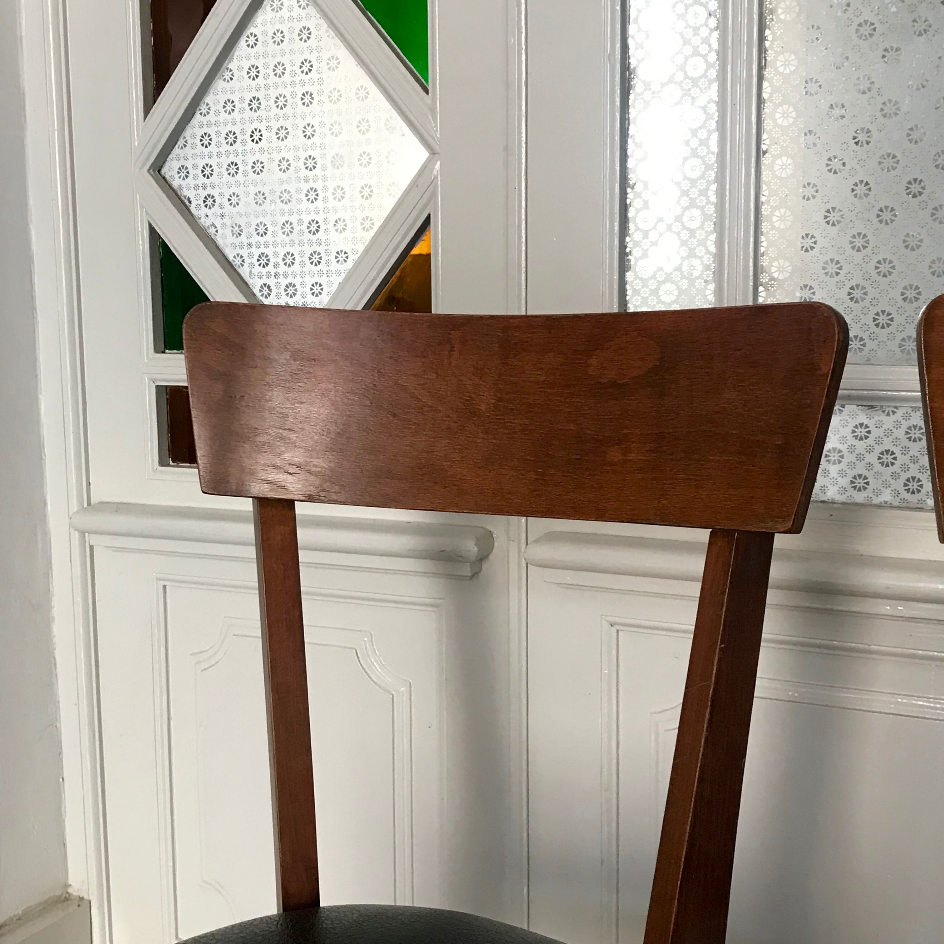 Vintage wooden and black skai chairs