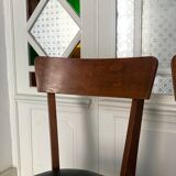 Vintage wooden and black skai chairs