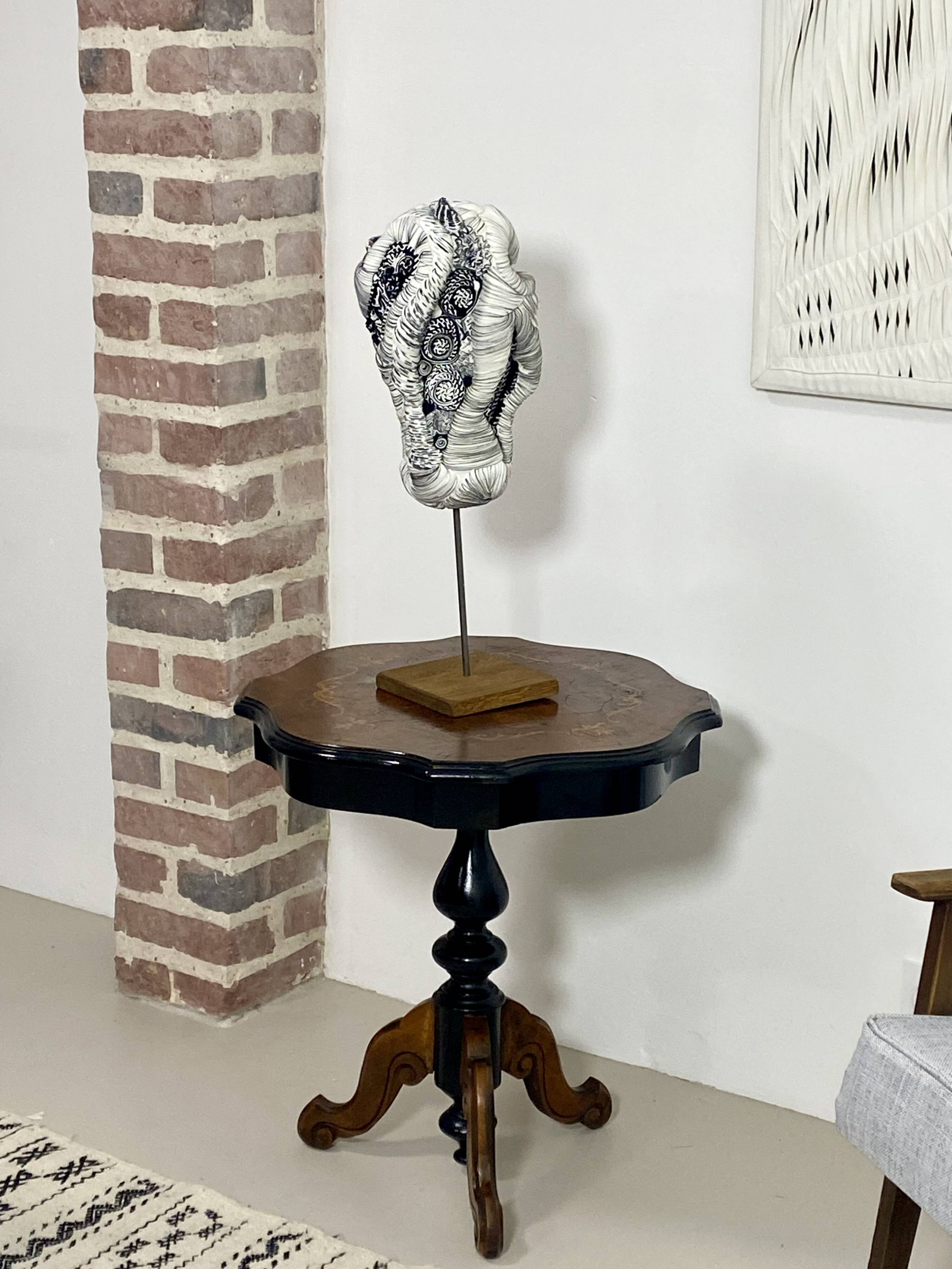 Two-tone black and mahogany pedestal table with mahogany veneer