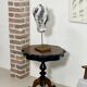 Two-tone black and mahogany pedestal table with mahogany veneer