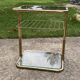 Italian side table in gilded brass and glass, Hollywood Regency style, 1970s.