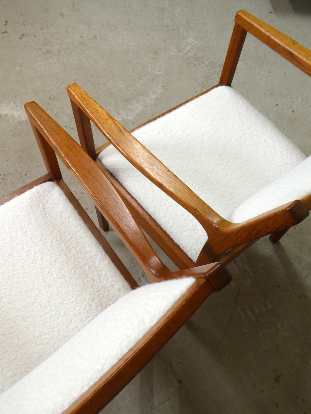 pair of Scandinavian teak armchairs and white buckles