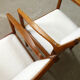 pair of Scandinavian teak armchairs and white buckles