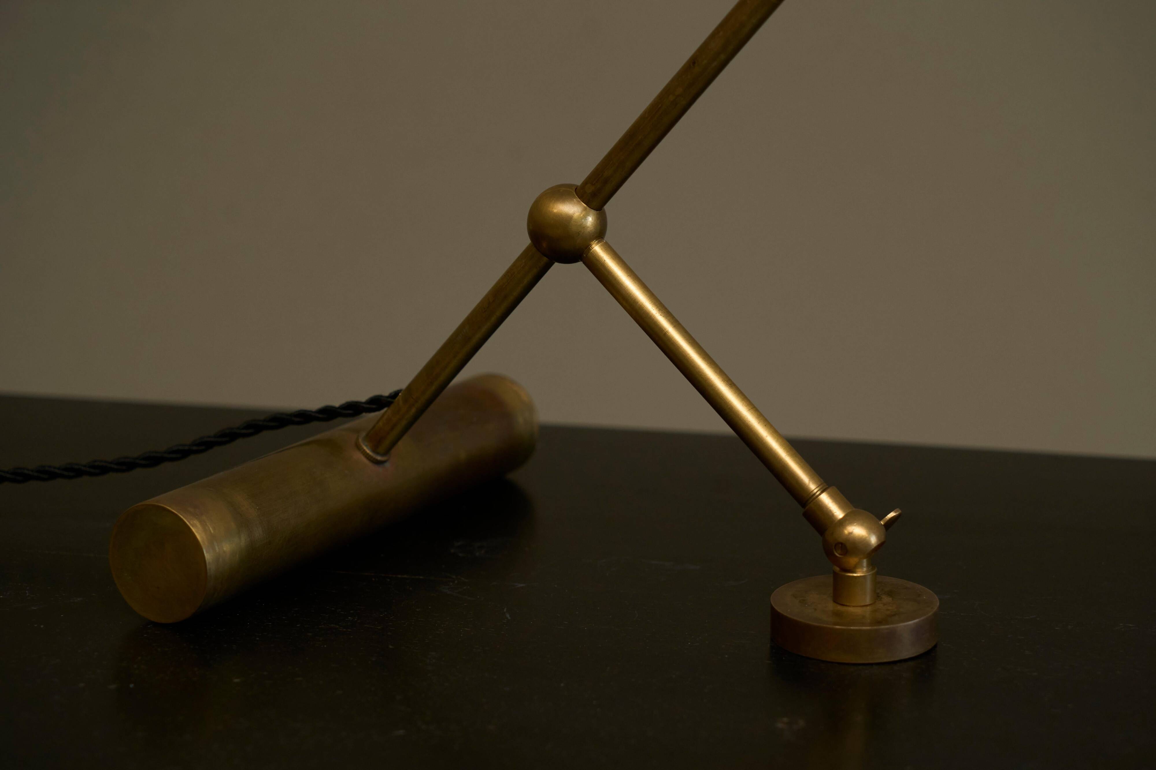 Mid Century adjustable table lamp with perforated shade from the 1950s.