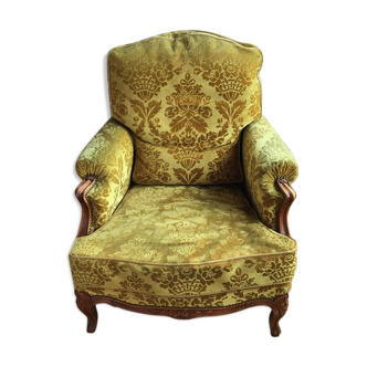 Armchair in golden yellow velvet and louis XV style cherry tree