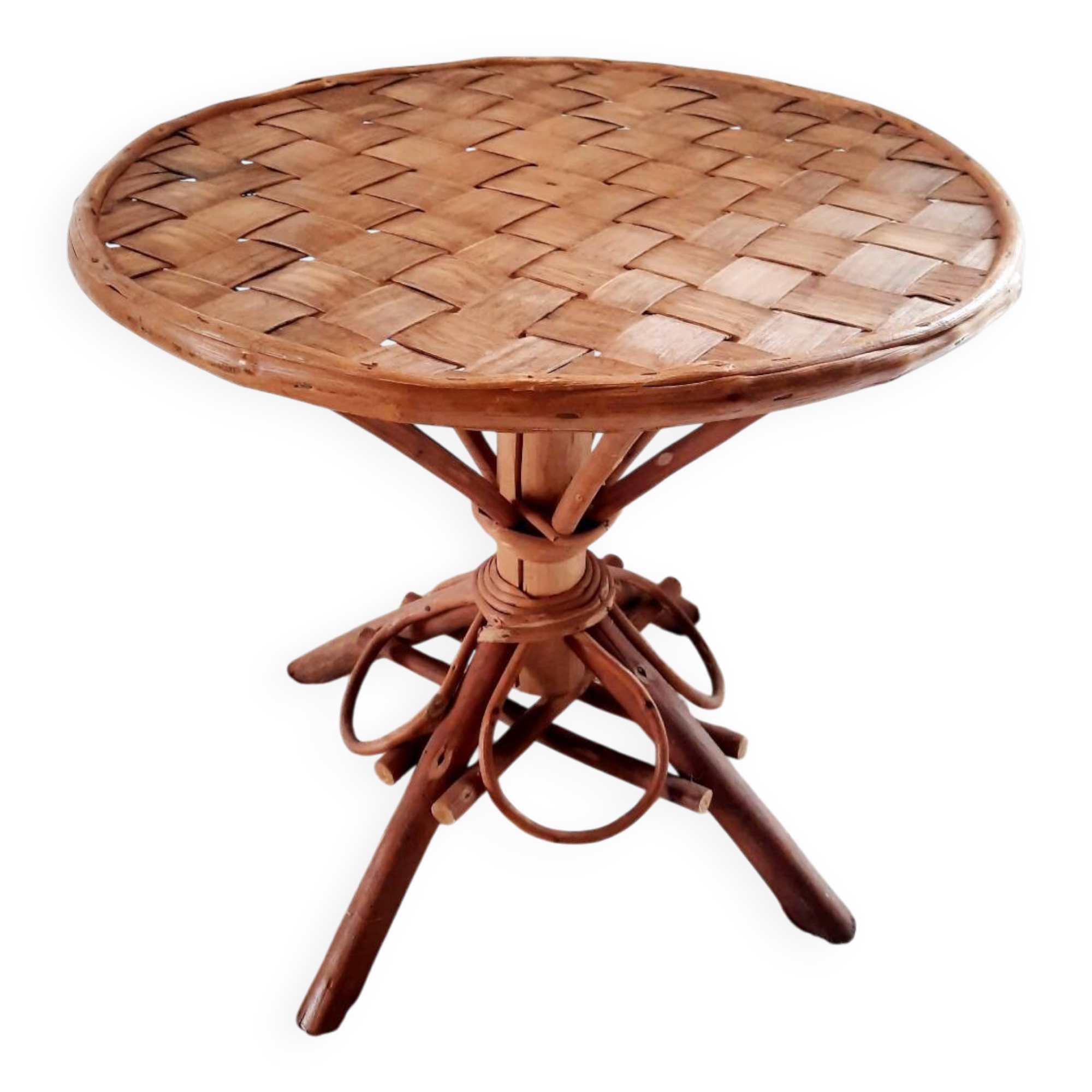Old bamboo/rattan table with woven palm leaves.