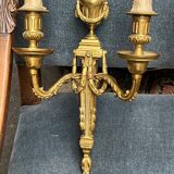 Pair of wall lights. Solid gilded bronze.