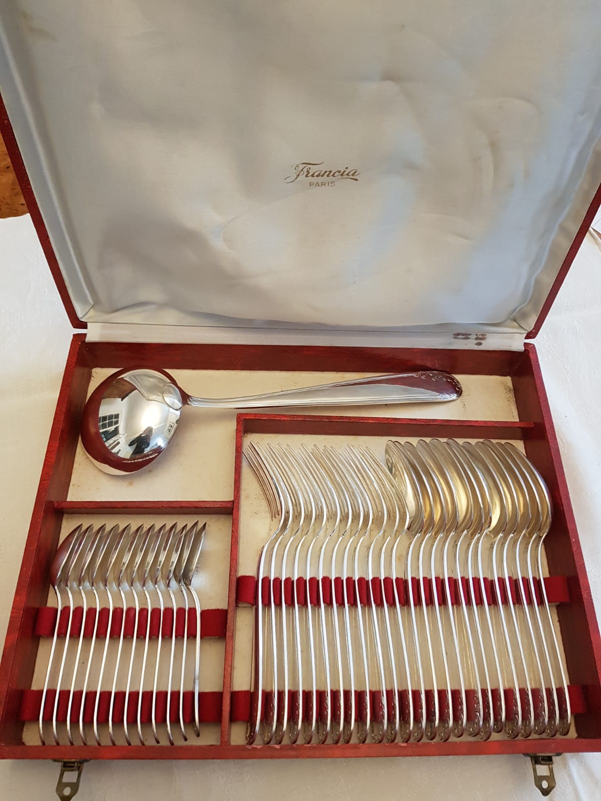 Silver cutlery set with 36 place settings and ladle