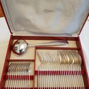 Silver cutlery set for 36 place settings and its ladle.