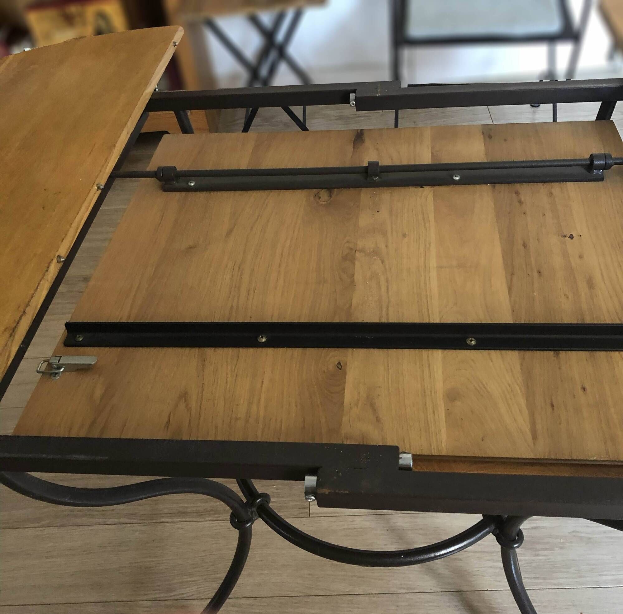 Extendable table in solid oak with wrought iron legs.