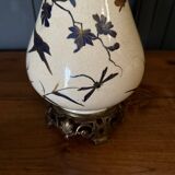 Porcelain lamp in the Indochinese style enhanced with gilding