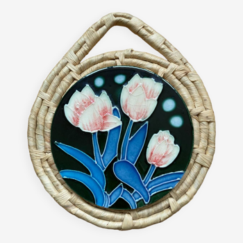 Ceramic and wicker trivet with tulip pattern