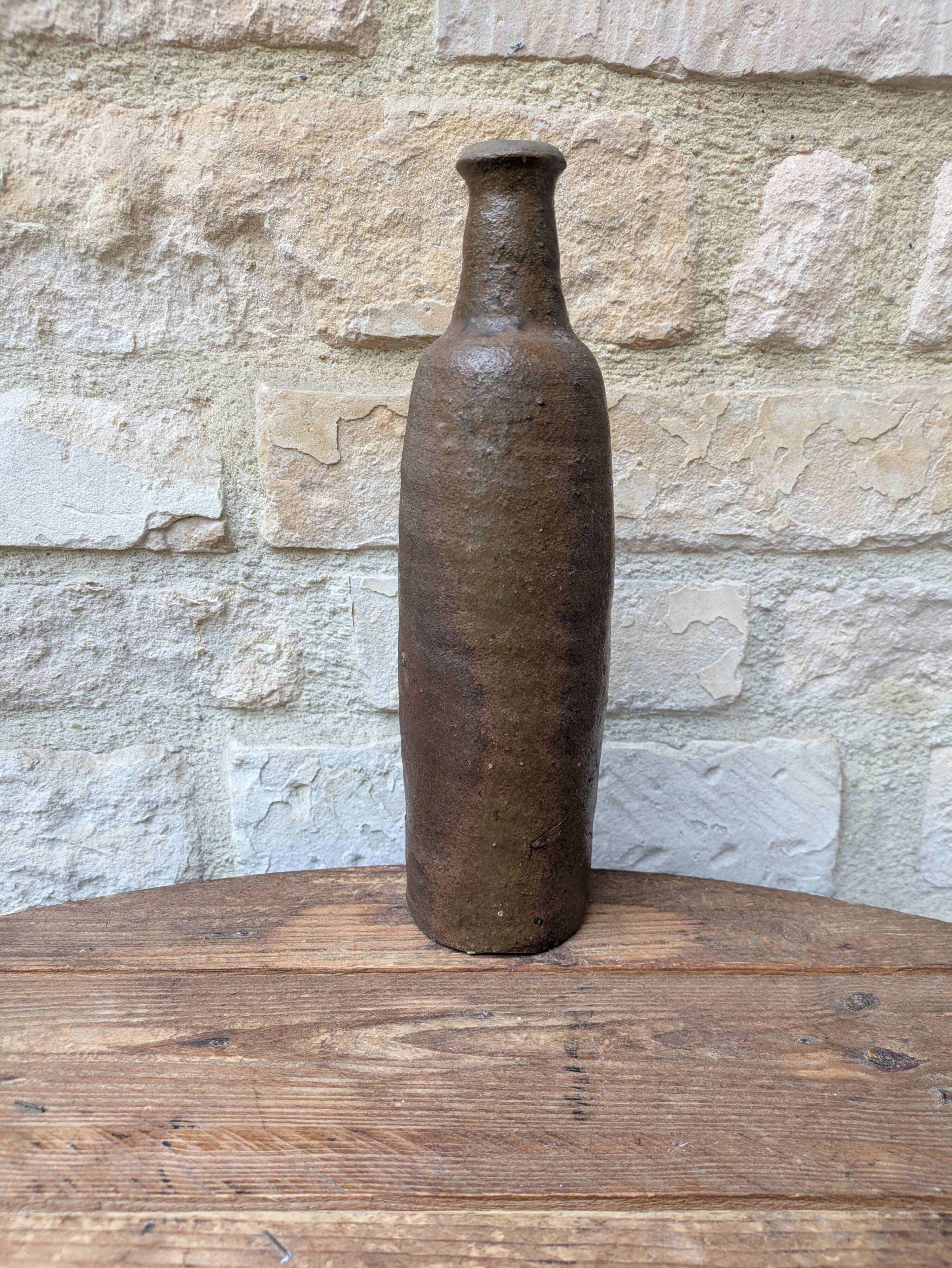 Old handmade terracotta bottle