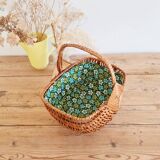 Small old basket with floral fabric interior