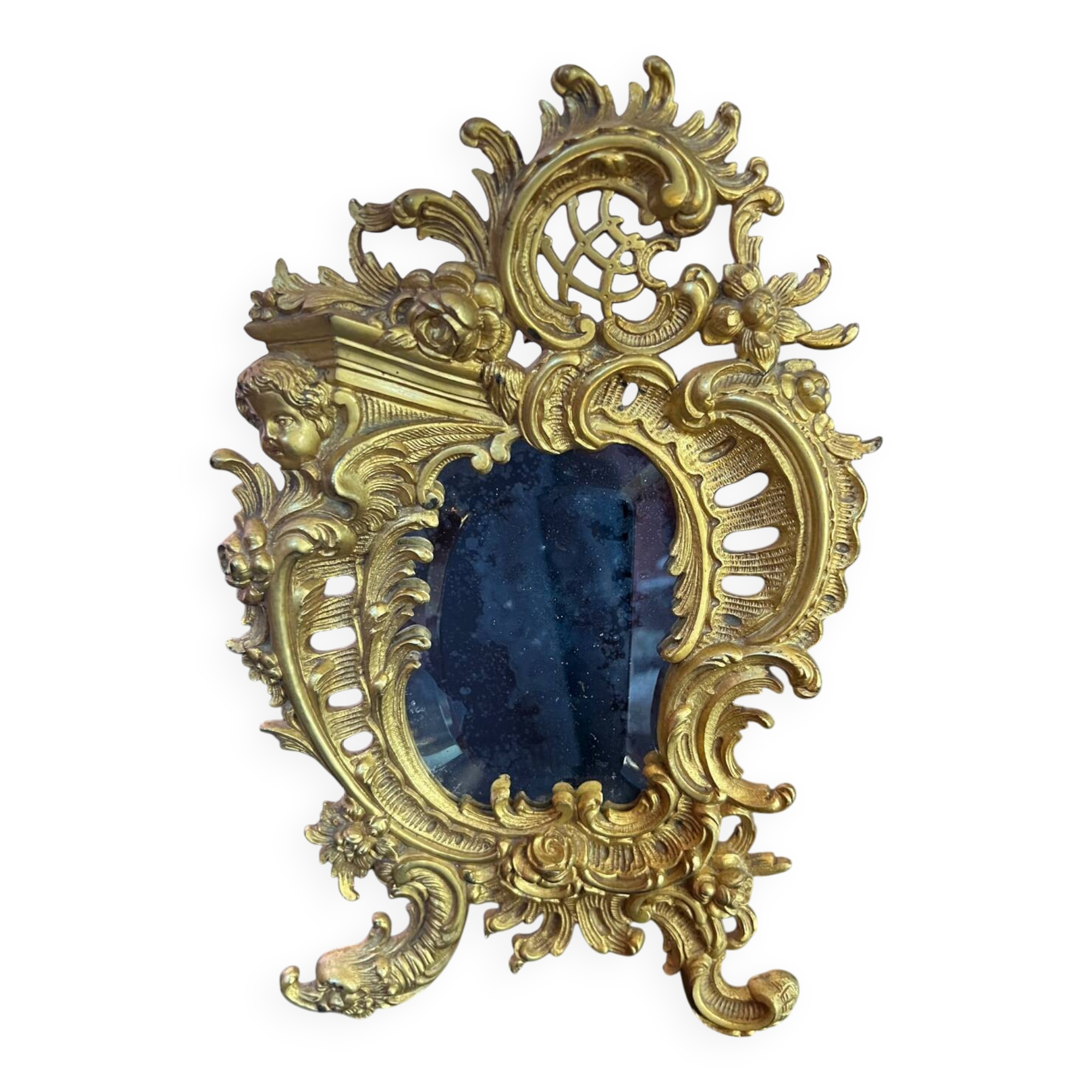 Beveled mirror in gilt bronze