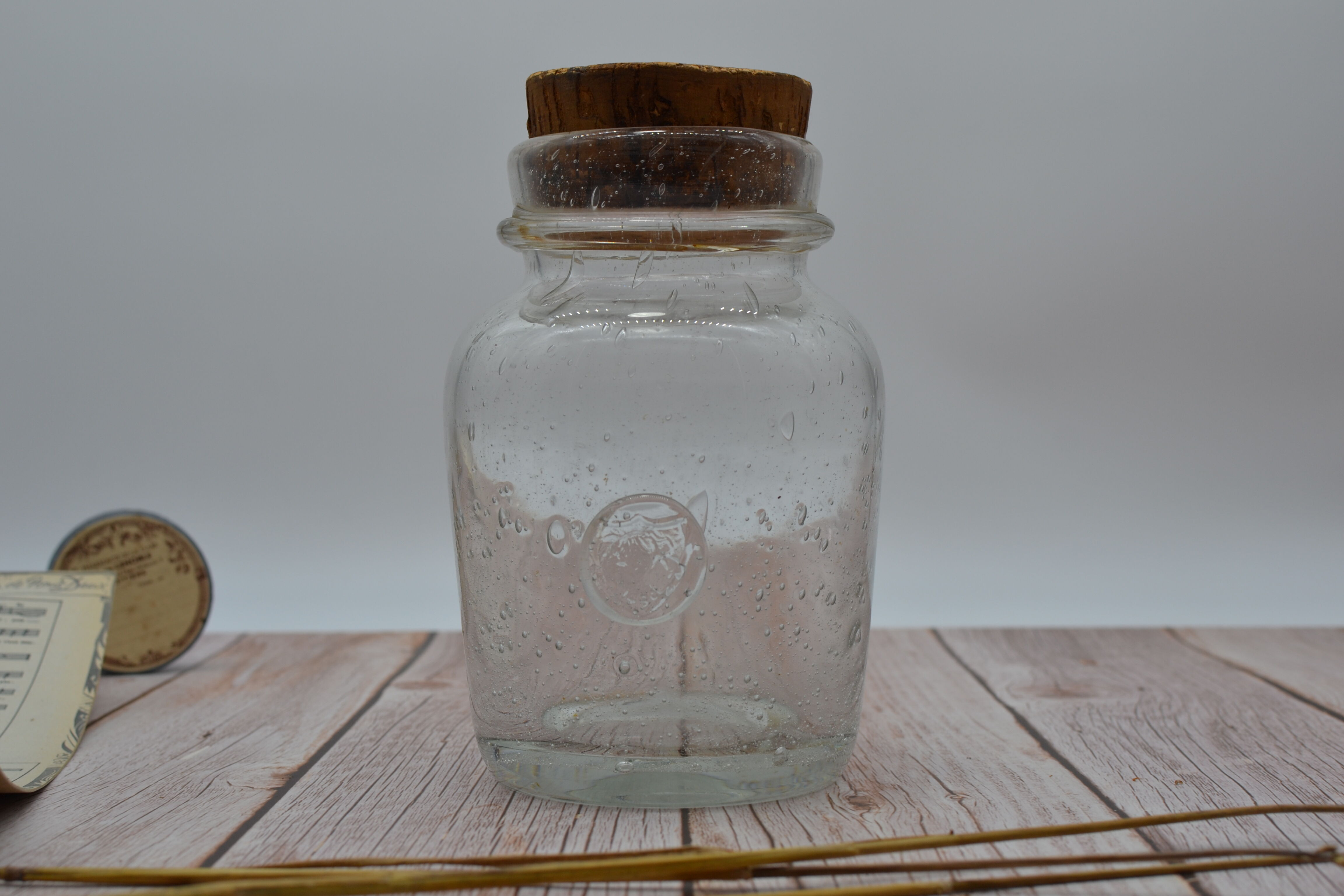 Blown glass jar with original cap