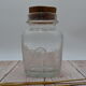 Blown glass jar with original cap