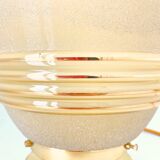 Old globe table lamp in beige and gold glass