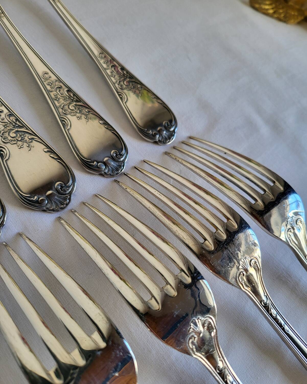 12 large silver-plated metal table forks by Guildart