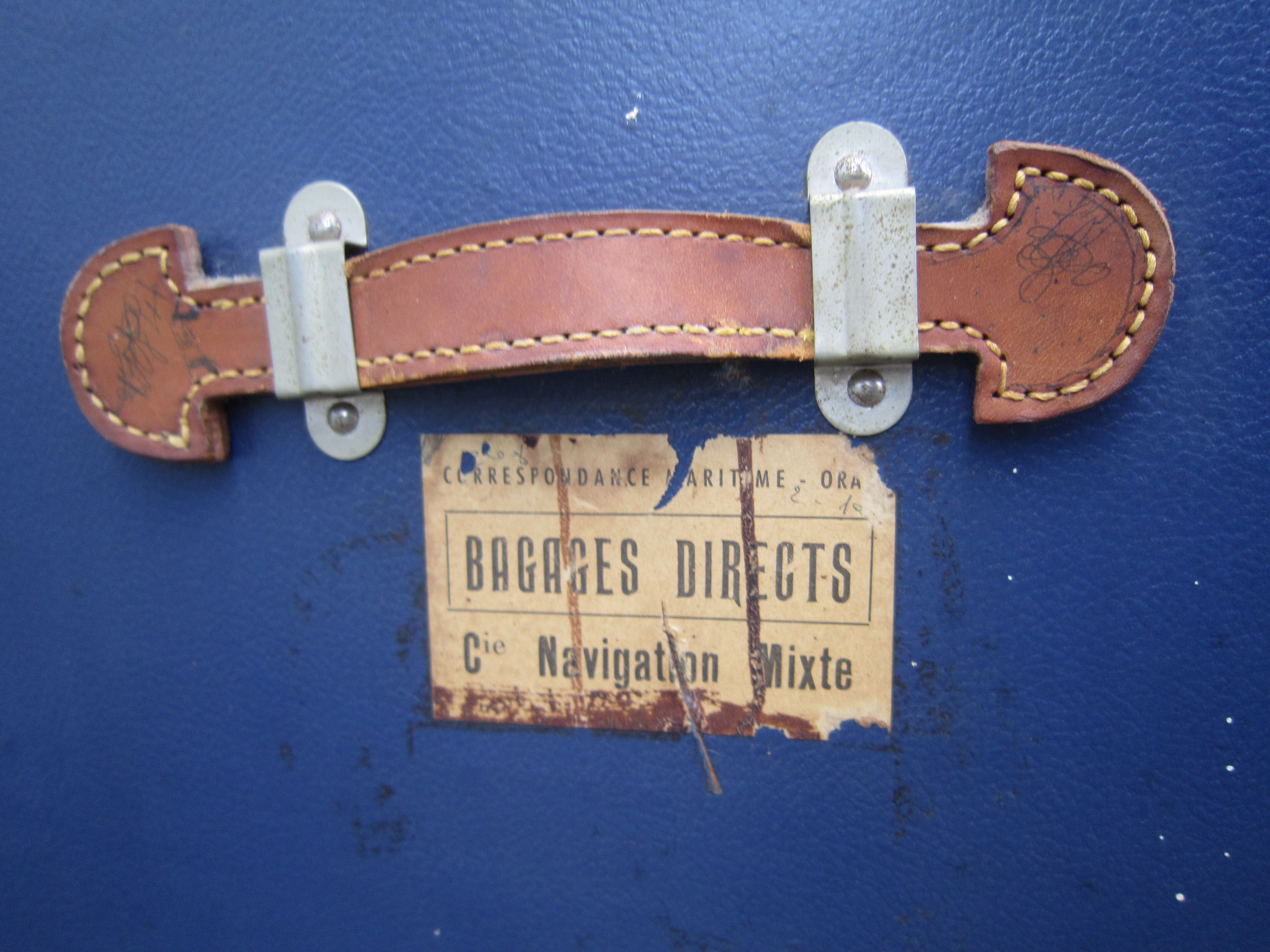 Old blue travel trunk handle leather