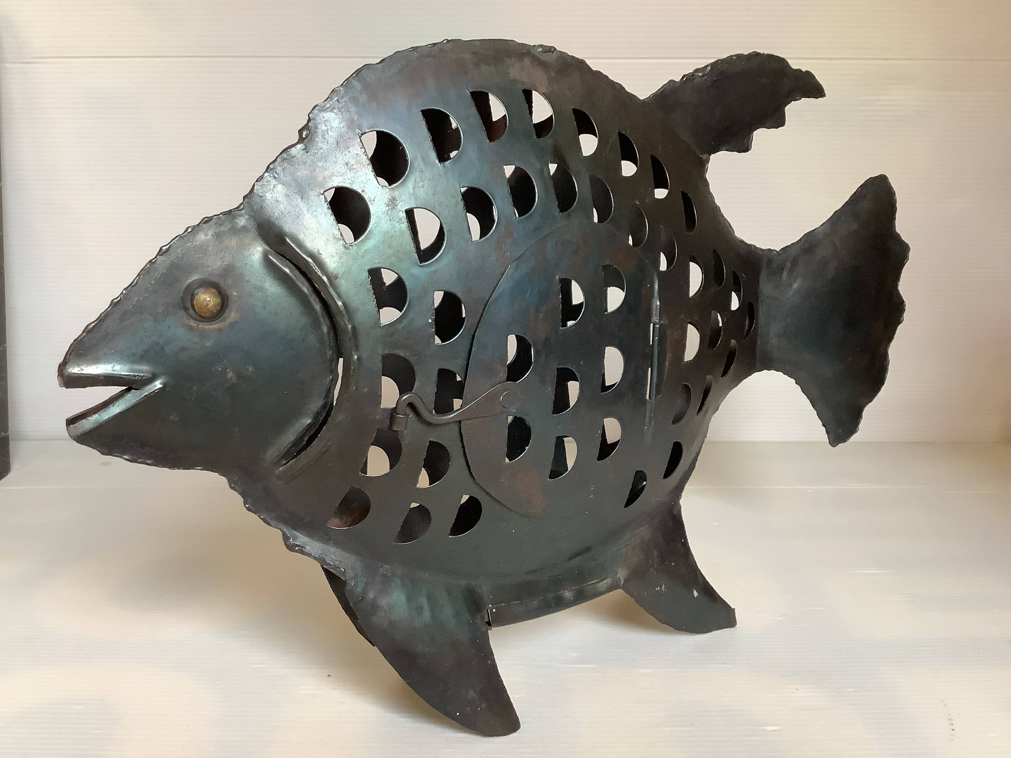 Large metal fish-shaped candle holder