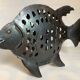 Large metal fish-shaped candle holder
