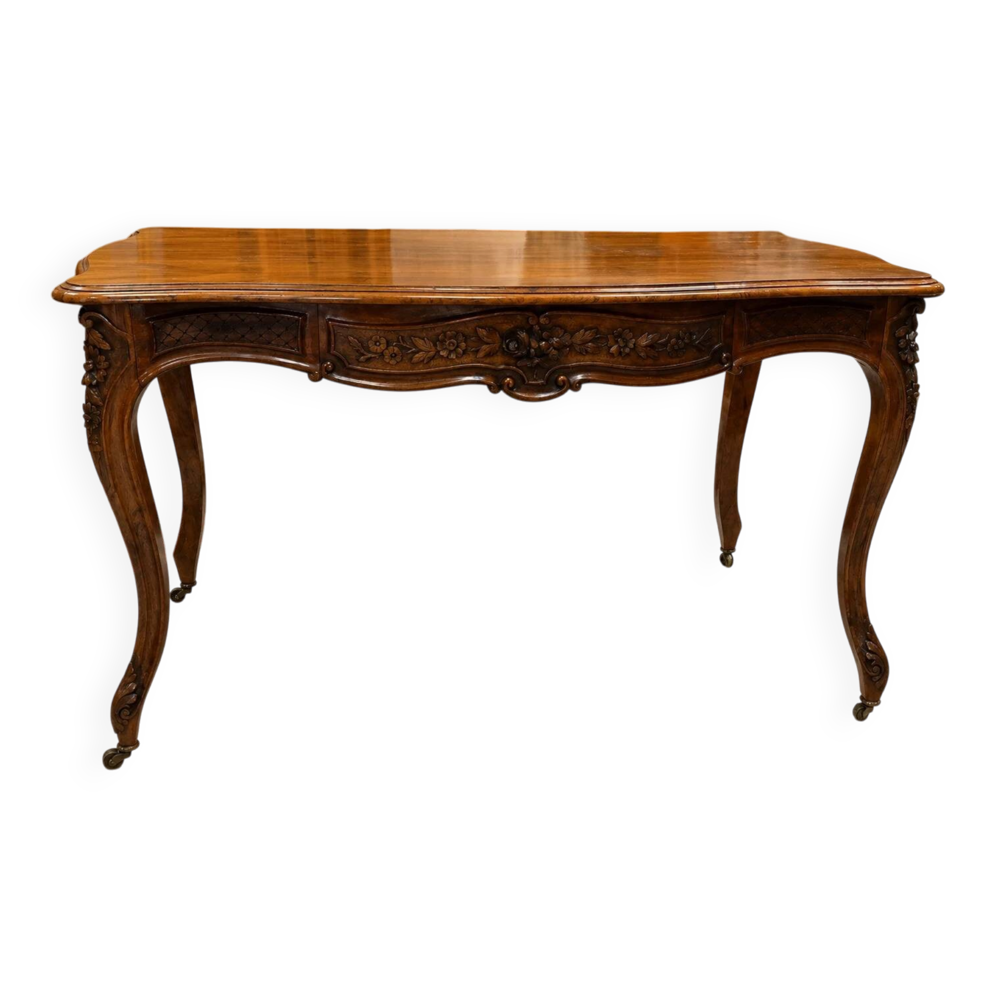 Curved desk in Louis XV style, made of carved and moulded walnut.