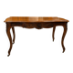 Curved desk in Louis XV style, made of carved and moulded walnut.