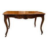 Curved desk in Louis XV style, made of carved and moulded walnut.