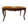 Curved desk in Louis XV style, made of carved and moulded walnut.