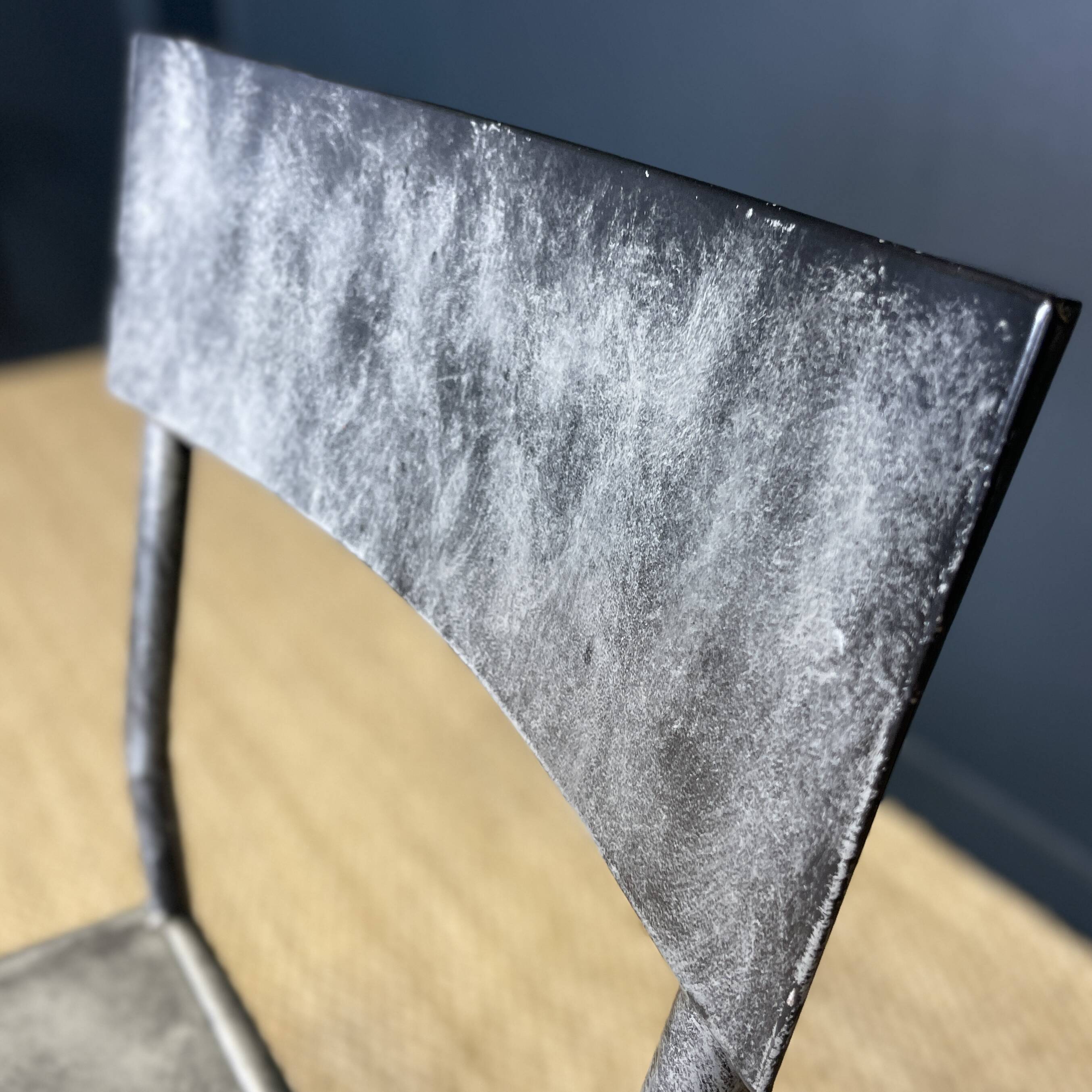 Pair of gray metal industrial chairs