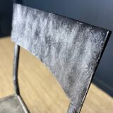 Pair of gray metal industrial chairs