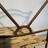 Wrought iron chair with woven seat
