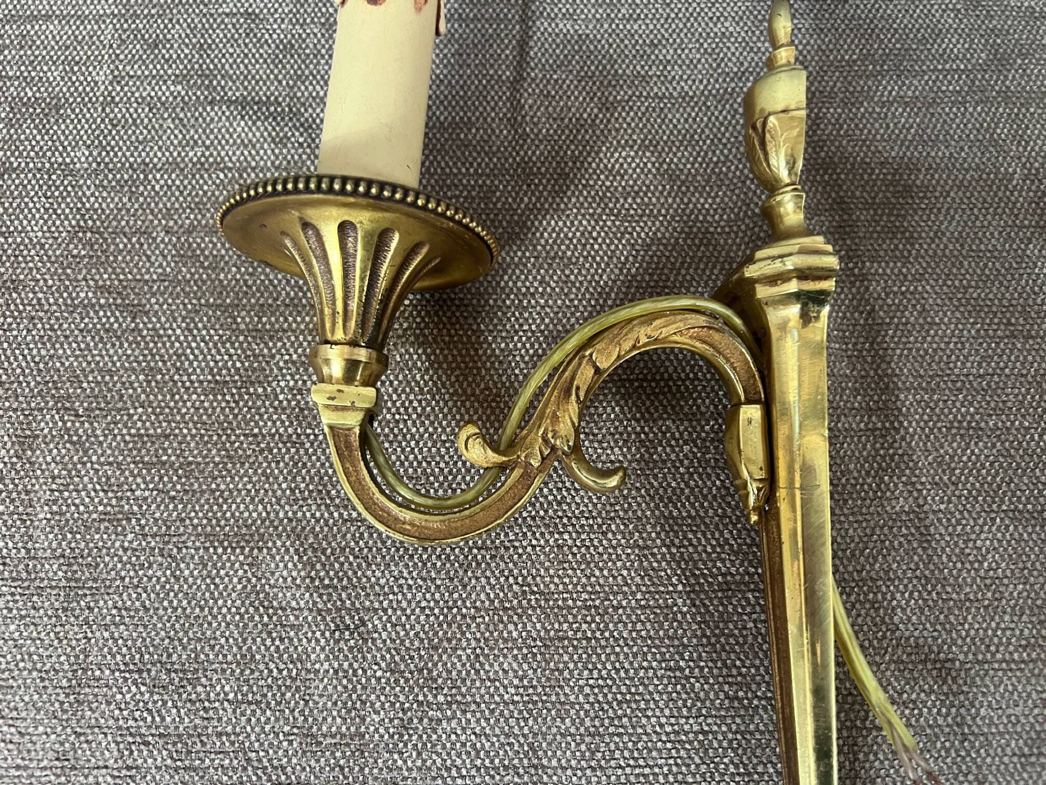 Pair of wall sconces in Louis XVI style. Solid bronze.