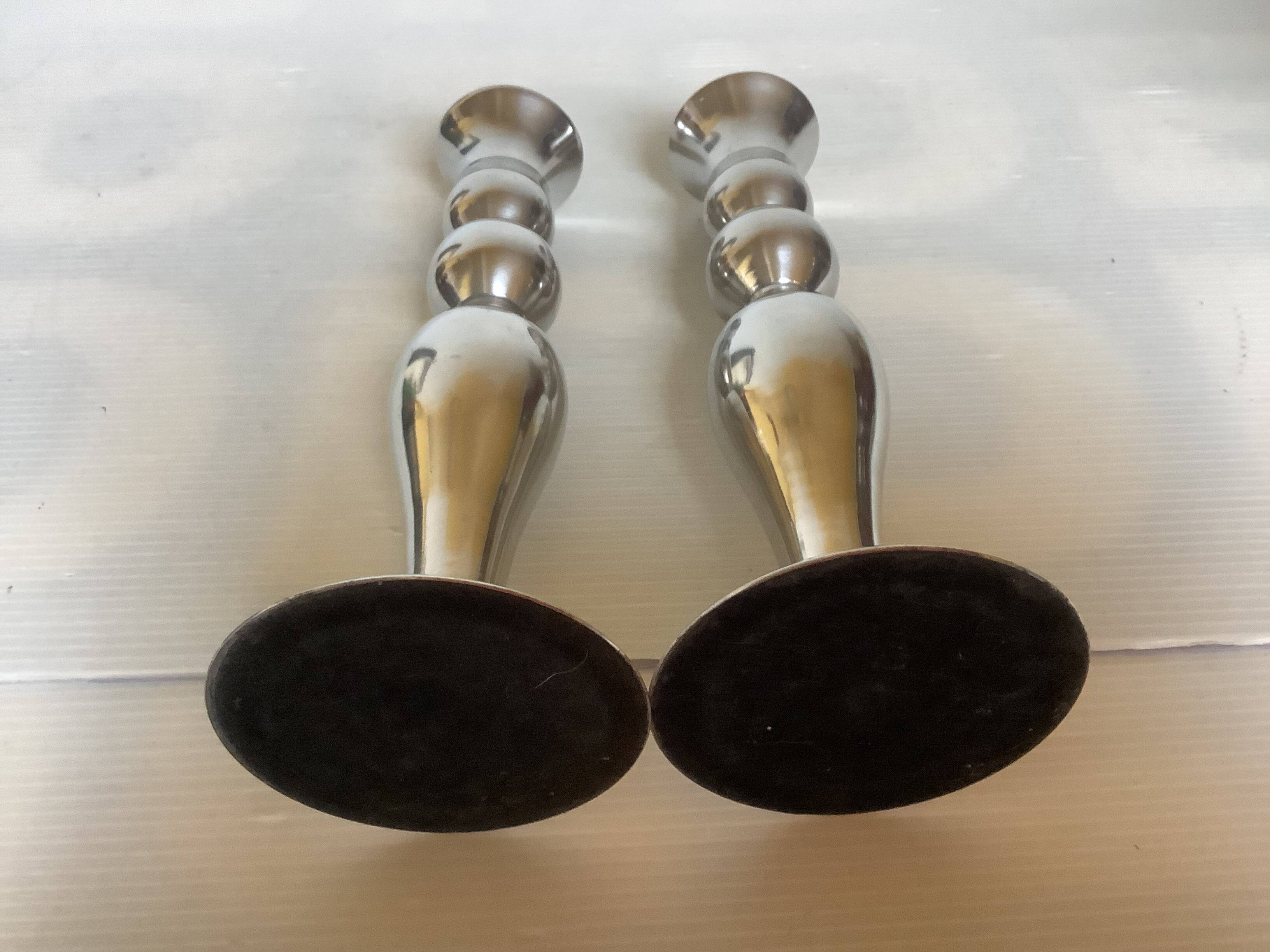 Pair of silver metal candlesticks