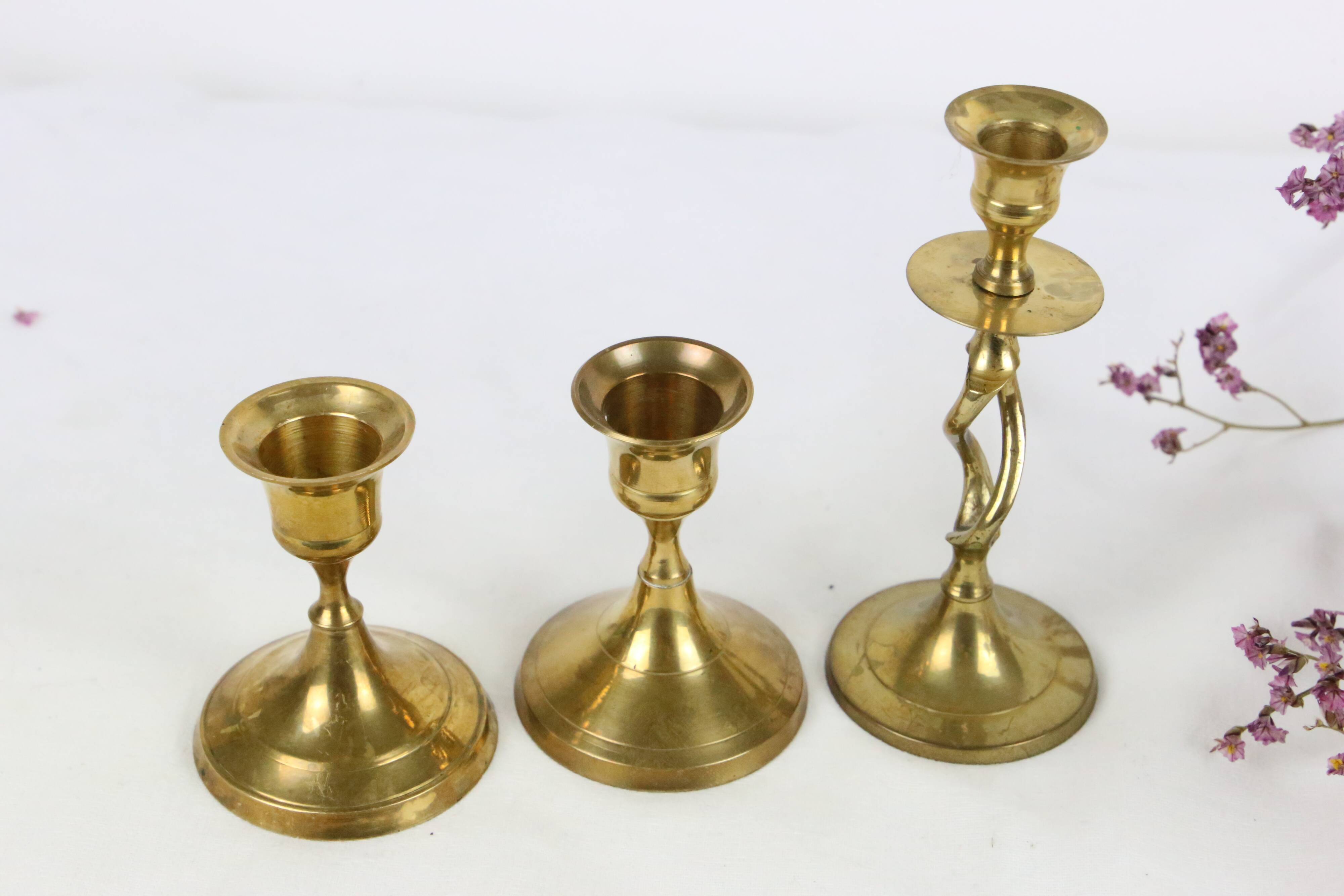 Trio of brass candle holders, vintage