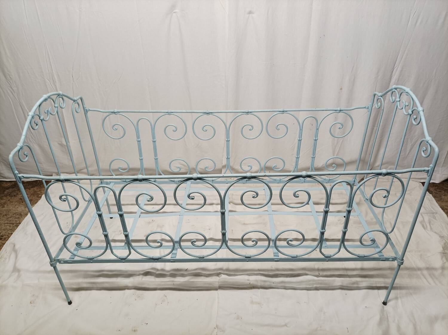 Old children's bed with metal bars
