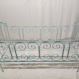 Old children's bed with metal bars
