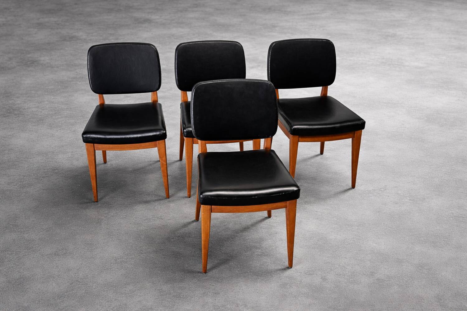 Set of 4 vintage 1960s chairs in wood and black faux leather – design