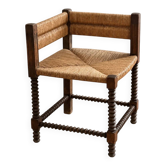 Corner armchair with turned legs in a bead style, in the manner of Charles Dudouyt — France, circa 1940