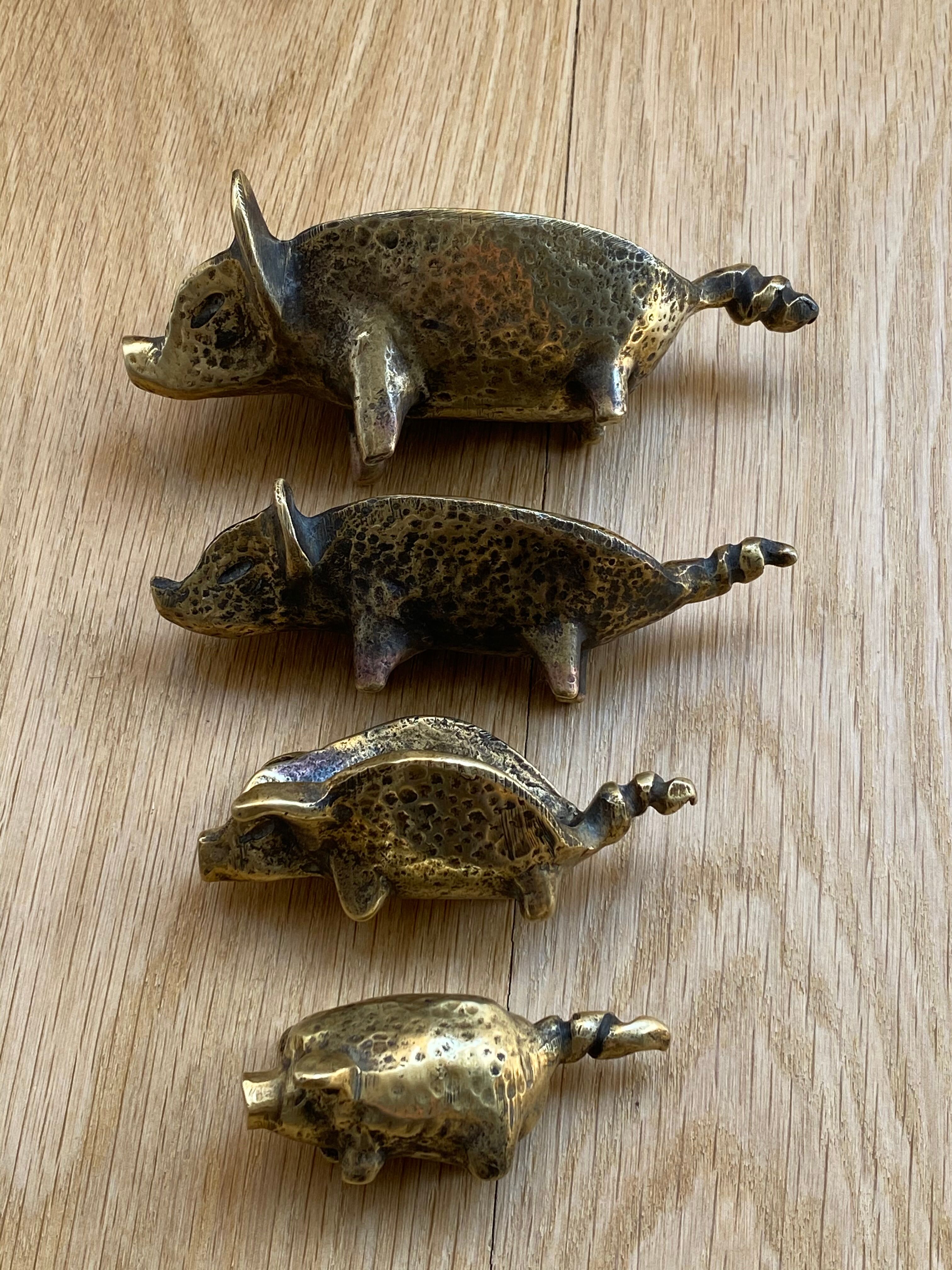 4 Pfizer bronze ashtray pigs