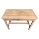 Art Deco farmhouse table made of raw wood.