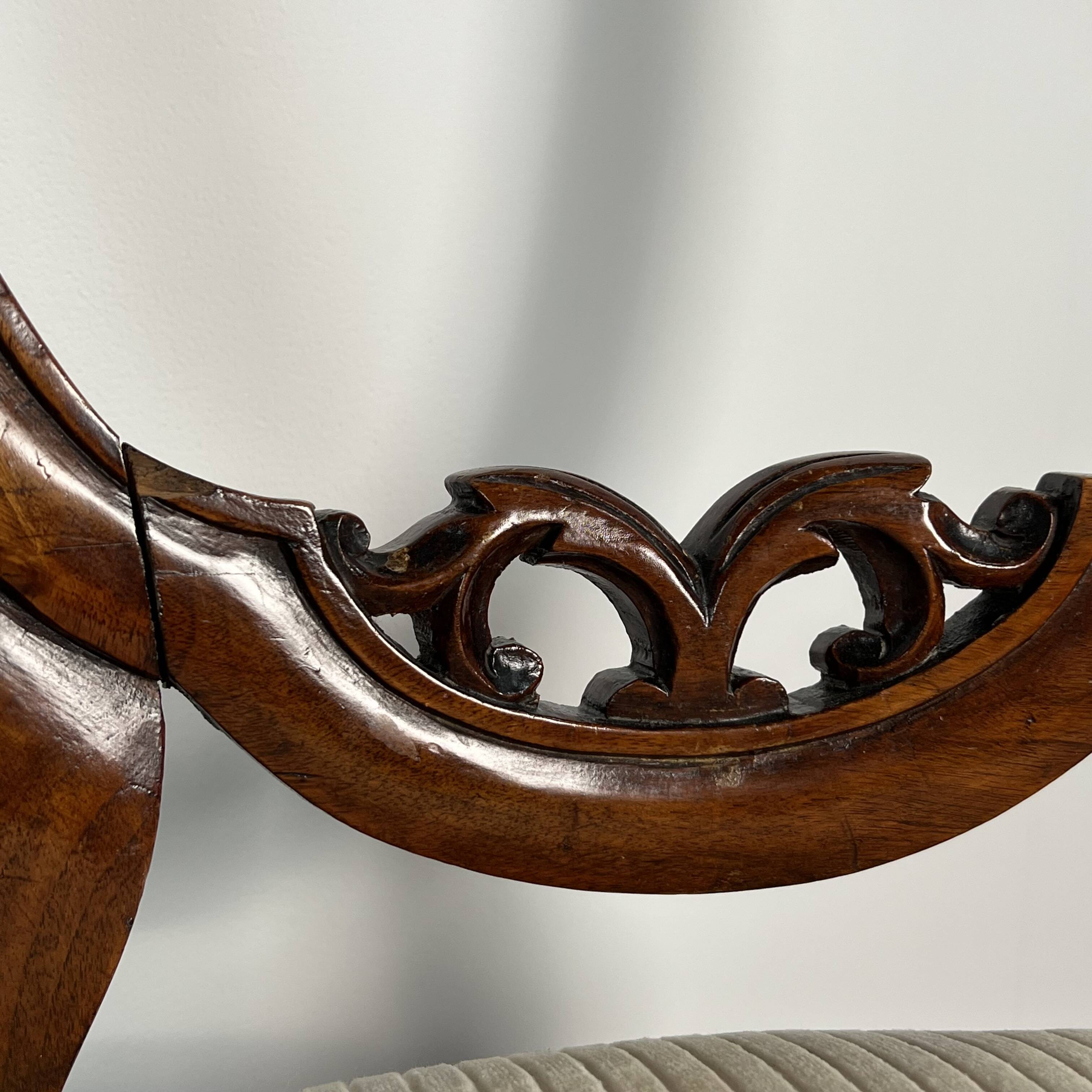 Pair of Victorian English chairs known as balloon chairs in solid mahogany.
