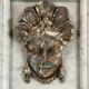 Female mascaron in grey Ardennes marble from the Regency period, 18th century.