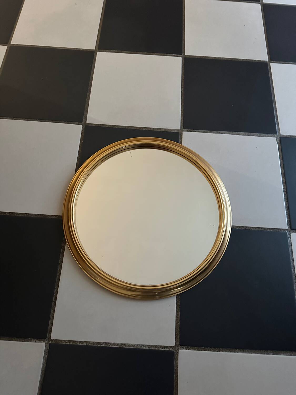 Round golden mirror