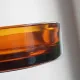 Vintage Italian round ashtray in thick amber glass – Ø 15 cm