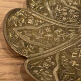 Brass candle holder on frame