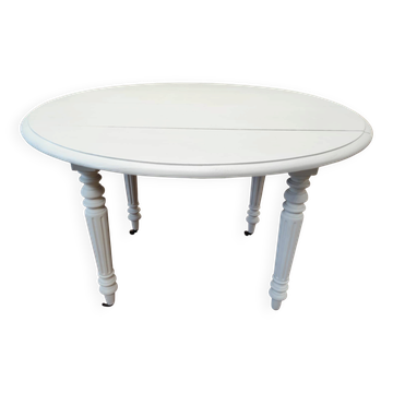 Round mahogany table convertible into a console.