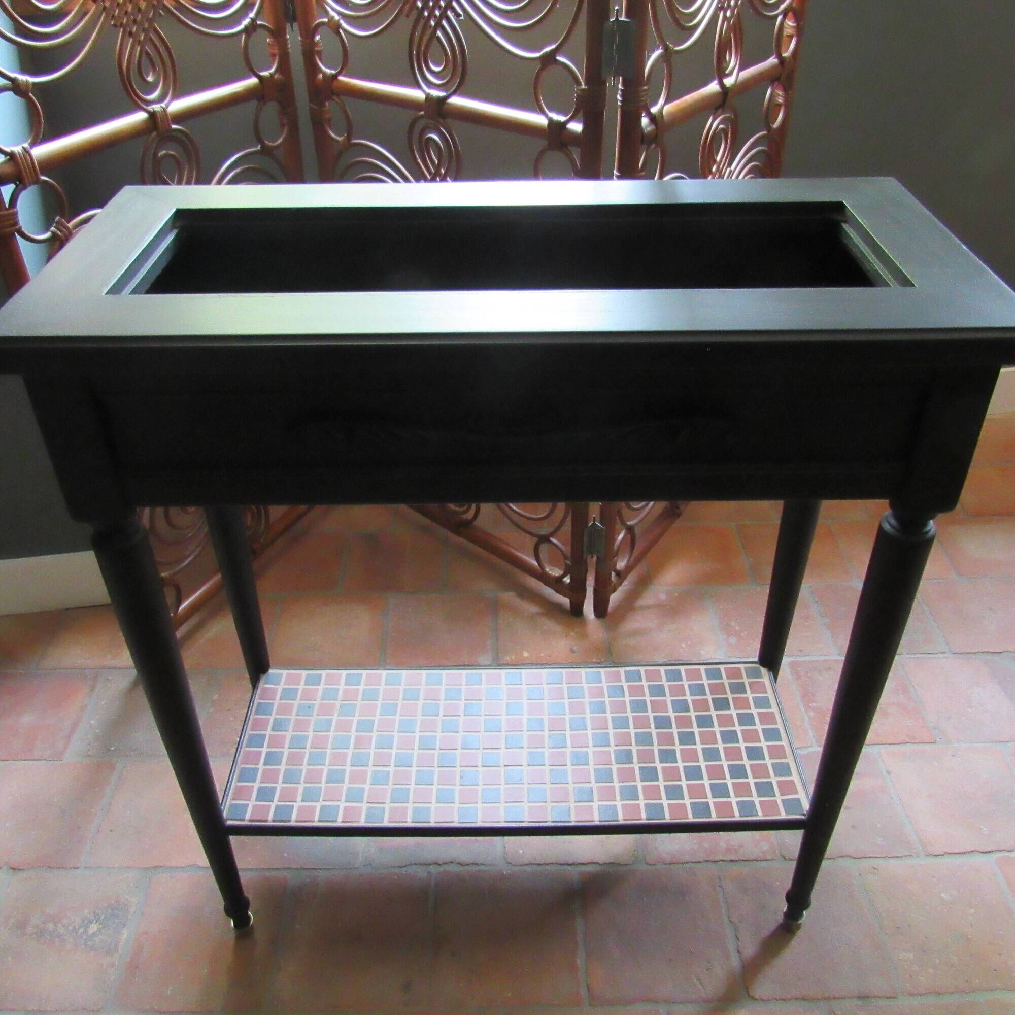 Vintage planter on wheels made of oak, repainted in black.