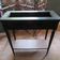 Vintage planter on wheels made of oak, repainted in black.